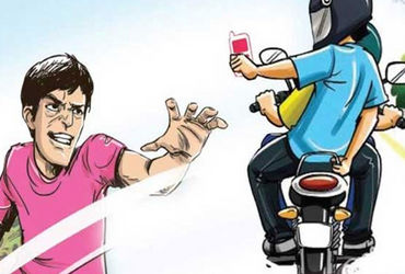 મોબાઈલ વાપરતા યુવકના હાથમાંથી બાઈક સવારે ફોન ઝૂંટવ્યો, ત્રિપુટી ફરાર  

## Mobile Theft Incident in Vadodara: Thief Snatches Phone, Escapes on Bike

A daring theft occurred in Vadodara as a thief snatched a mobile phone from a youth while he was talking on it. The incident, captured on CCTV, shows the thief riding a bike and swiftly grabbing the phone.

### Key Points:

- Location: Vadodara, an area prone to such thefts
- Perpetrator: A bike rider wearing a helmet and mask
- Victim: A youth who was speaking on his mobile phone
- Method: The thief grabbed the phone from the victim's hand
- Escape: The thief fled the scene on a motorbike
- Evidence: The entire incident was recorded on CCTV
- Current Status: The thief is still at large
- Advice: Public advised to be cautious while using mobile phones in public areas

### Additional Details:

The incident took place where another young man was talking on his phone near a shop. The bike rider, wearing a helmet and mask, approached the youth and snatched his Samsung Galaxy A04 mobile phone. The thief then quickly escaped the scene, heightening the need for increased vigilance in such areas.

The police are currently investigating the incident, and efforts are underway to apprehend the thief. They have appealed to the public for any information that might help in locating the culprit. In the meantime, citizens are being warned to be cautious and avoid using their mobile phones in inconvenient and potentially risky locations.

Bike riders are also reminded to wear helmets for safety, and the public is encouraged to remain aware of their surroundings to prevent such crimes.